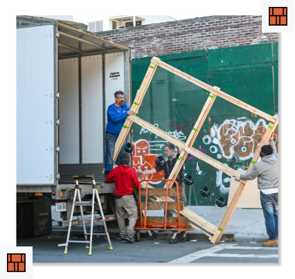 movers moving a bed frame